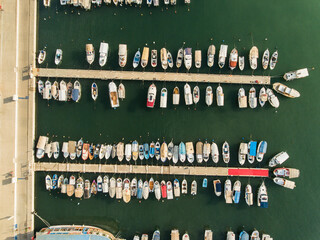 Aerial view of harbor full of sailboats and fishing boats at Mediterranean Sea 