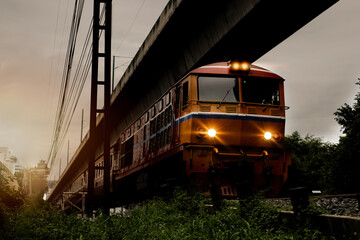 Diesel train trains with traditional public transport Thai style for commuting train approaches Phitsanulok Railway Station city in Thailand