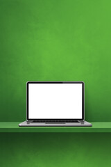 Laptop computer on green shelf. Vertical background