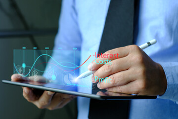 Businessman analyzes interest rates and profits. interest rates on virtual screens. Business, Technology, Internet and network concept. costs.