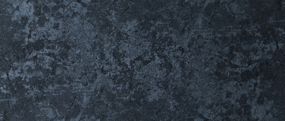 Fototapeta premium Old grunge stucco wall texture, dark blue faded marbled stone or rock textured, scratched and blurry grunge texture, Hard and cracked blue background with vintage grunge.