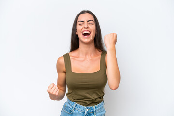 Young caucasian woman isolated on white background celebrating a victory