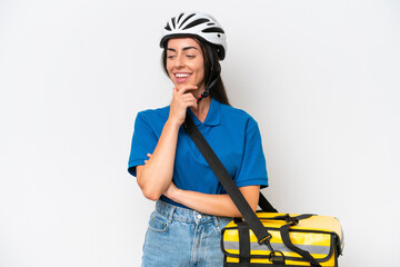 Young caucasian woman with thermal backpack isolated on white background looking to the side