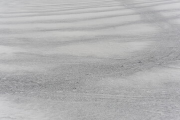 A snowy black and white and grey rural landscape with fields covered with snow in Hokkaido, northern Japan, Asia