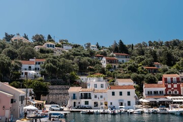 Fototapeta na wymiar Loggos harbour with cute houses on Paxos, Greece
