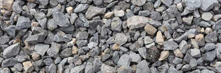 Panoramic image. Gray gravel stones. Gravel stones background