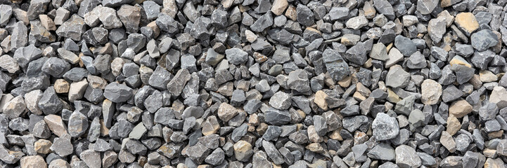Panoramic image. Gray gravel stones. Gravel stones background