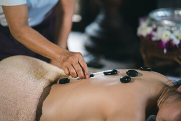 Massage and spa relaxing treatment of office syndrome using hot stone traditional thai massage...