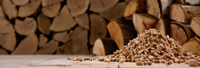 Woodpile and stack of pellets in wooden house - 518908444
