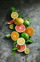 Fototapeta na wymiar Halved citrus fruits on table