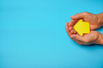 Red ribbon in hand with blue background, heart health, donate, happy volunteer charity, corporate social responsibility, world heart day, world health day, world mental health day,  concept
