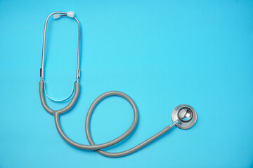 Stethoscope on blue background, Doctor using it. Medical equipment. Hospital,