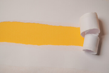 Torn paper on yellow background. Paper, advertising, design, space.