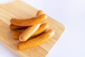 Sausage on wooden cutting board.