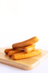 Sausage on wooden cutting board.