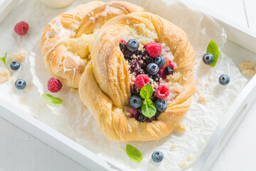 Fresh and tasty yeast cake with raspberries and blueberries