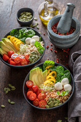 Colorful salad with vegetables, olive oil and buckwheat groats.