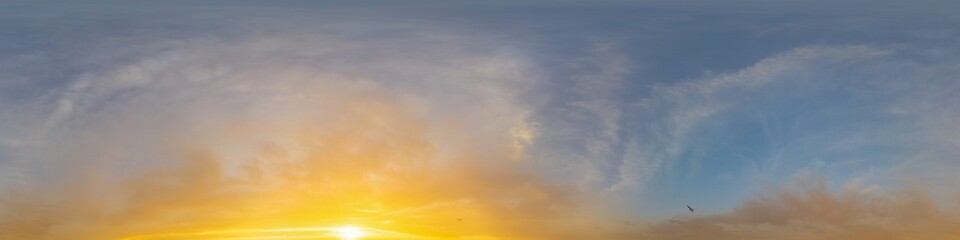 Golden glowing sunset sky panorama with Cirrus clouds. Hdr seamless spherical equirectangular 360 panorama. Sky dome or zenith for 3D visualization and sky replacement for aerial drone 360 panoramas.