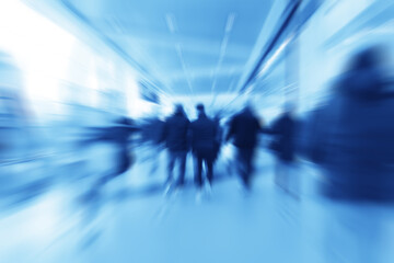 group of people movement blurred light background inside