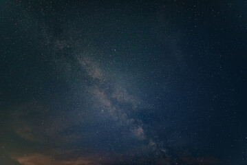 Naklejka na ściany i meble Beautiful noctilucent cloud formations against Milky Way background night sky