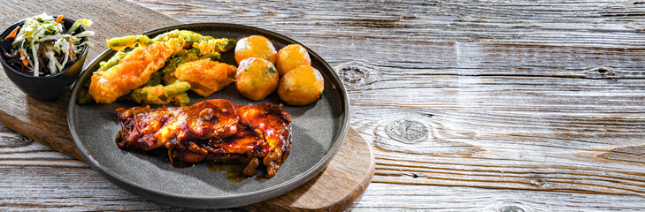 Chicken thighs in tamarind sauce with veggies tempura and potato