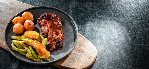 Chicken thighs in tamarind sauce with veggies tempura and potato