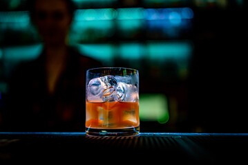 bartender making Cuba Libre cocktail in bar