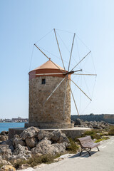 Fototapeta na wymiar The medieval windmills in Mandraki harbour in Rhodes, Greece
