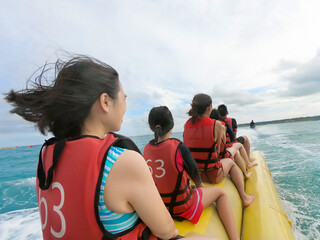 family enjoy banana boat