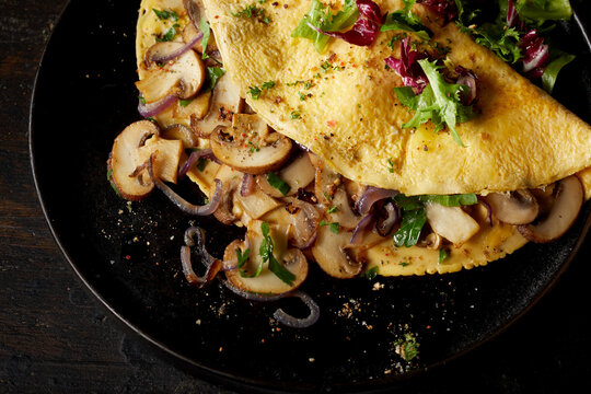 Mushroom omelette on plate on table