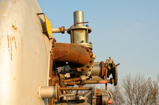 Details of an old burner for gas combustion (sugar factory industrial equipment), side view, close-up, selective focus