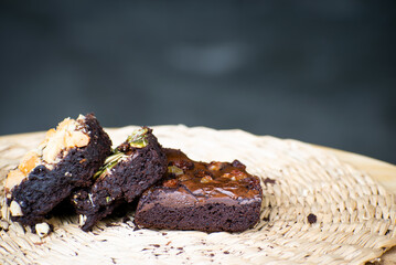 Delicious chocolate brownie homemade, ingredients of brownie,closeup fudge brownie,homemade bakery and dessert,Pieces of fresh brownie,confectionery concept.