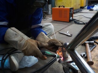 Worker, Welder Sitting welding work