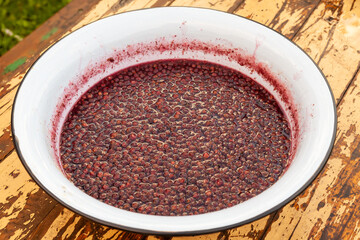 Making a strawberry jam. Boil strawberries in the pan. Texture fruit, strawberry jelly. Do it yourself process, homemade food