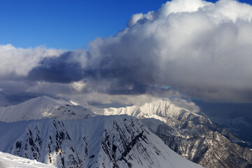 Snow mountains and blue sky with clouds