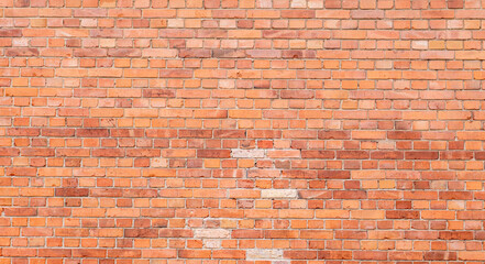 red old brick wall with gray joints