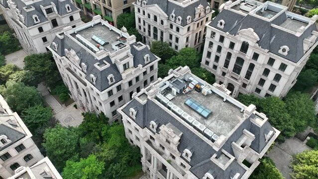 Houses in European style in the city. Drone aerial view. Rows of buildings of Victoria era style in the downtown area in Shanghai China.  Economy business, house development  concept b-roll footage.