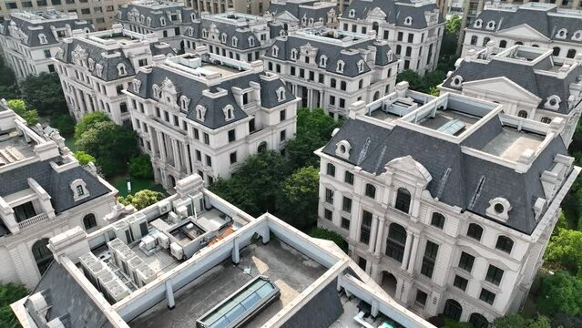 Houses in European style in the city. Drone aerial view. Rows of buildings of Victoria era style in the downtown area in Shanghai China.  Economy business, house development  concept b-roll footage.