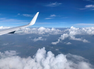 Fototapeta premium Airplane Window View on Clouds 7