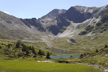 Fototapeta na wymiar Landscape of a lake in the mountains. Lac des Bouillouses