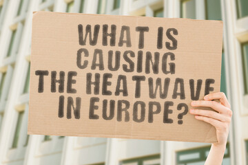 The phrase " How heat kills " is on a banner in men's hands with blurred background. Disaster. Extreme. Temperature. Urban. Orange. Sunny. Day. Apocalypse. Environment. Heat. Warm. Sunlight. Hot
