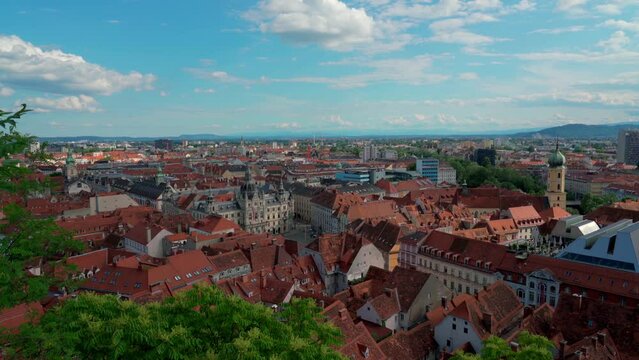 Aerial panorama view of Graz city old town from Castle Hill (Schlossberg) with historic buildings on a sunny summer day,  with blue sky cloud, Graz, Styria, Austria