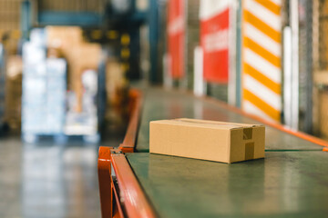 parcel box on conveyor belt products goods delivery shipping from warehouse inventory stock management concept.