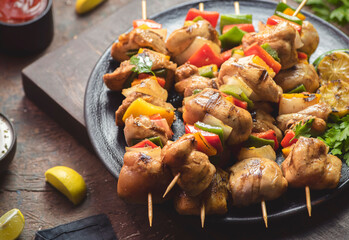 Arabic cuisine; Traditional grilled chicken Shish Kebabs or Shish Tawook on skewers. Close up with...