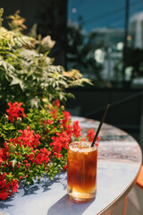 Espresso with ice cubes and tonic in glass. Summer refreshing menu in coffee shop.