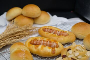 Fresh fragrant bread and bun on the table with copy space. Food concept