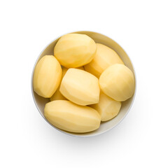 Raw peeled potatoes in bowl isolated on white background, top view