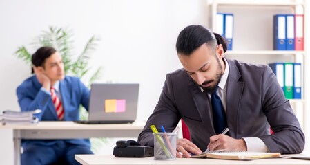 Two male colleagues in the office