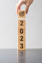 2023 block with dartboard sign. Business Goal, Target, Resolution, strategy, plan, Action...