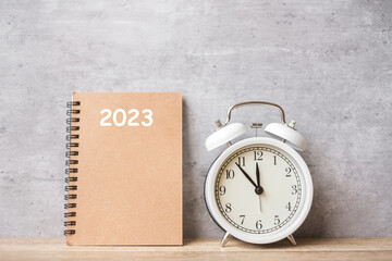 Happy New Year with vintage alarm clock and 2023 calendar. Christmas, New Start, Resolution, countdown, Goals, Plan, Action and Motivation Concept